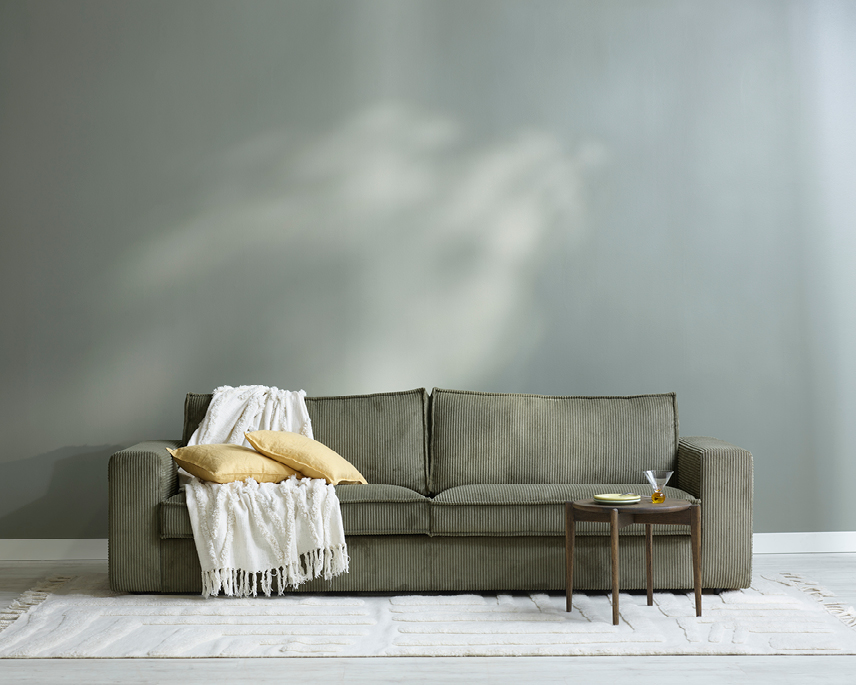 Grön soffa i manchestertyg